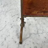Pretty mirrored fire screen with brass frame detail