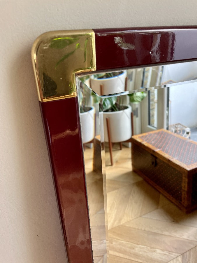 Italian Burgundy Lacquered Frame and Brass Cornered Mirror