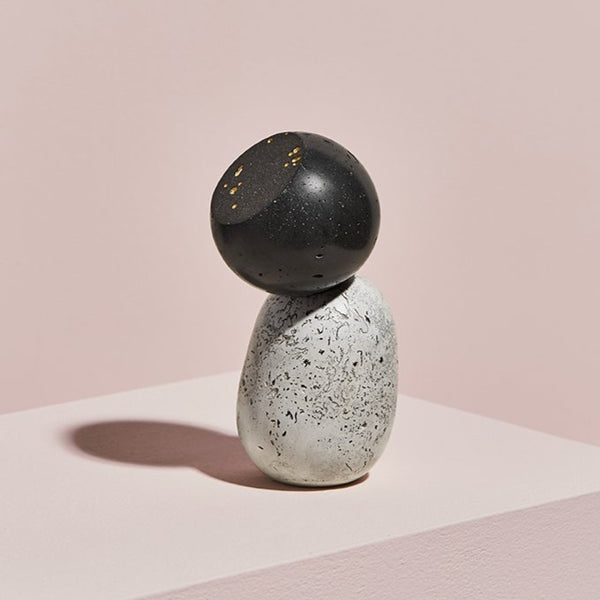 Black Speckled by Vic Wright, sculpture with 24k gold leaf, ink, pigment and casting cement.